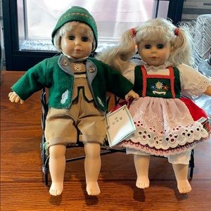 Handmade German Dolls sitting on Iron Bench
